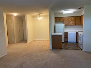 Spacious living room overlooking dining and kitchen area