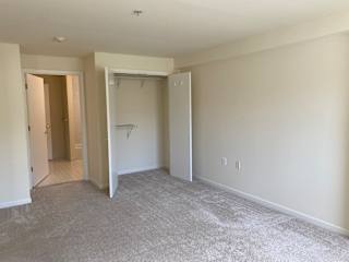 Bedroom with walk-in closet and bathroom entry