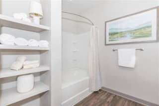 Bathroom with Shelves at One White Oak Apartments, Cumming, GA, 30041