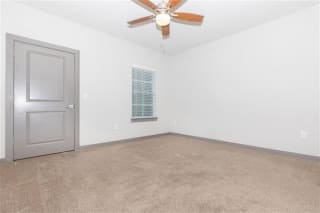 Room with Ceiling Fan at One White Oak Apartments, Georgia, 30041