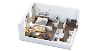A white room with a bed, desk, and chair.