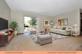 A living room with a white couch and a coffee table.
