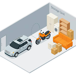 A storage unit with a car, a motorcycle, and boxes.