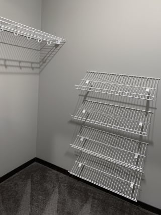Walk in closet with ample shelving space at the villas at mahoney park