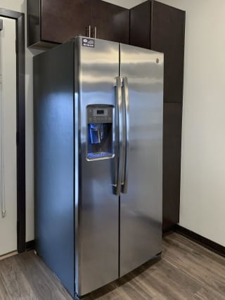 Stainless steel fridge with water and ice dispenser