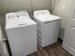 Washer and dryer laundry room at the villas at mahoney park