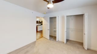 a bedroom with a closet and a ceiling fan a bedroom with a closet and a ceiling fan at Meadowbrooke Apartment Homes, Grand Rapids, Michigan