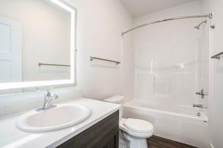a bathroom with a sink toilet and a shower a bathroom with a sink toilet and a shower at Meadowbrooke Apartment Homes, Grand Rapids, Michigan