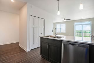 an empty kitchen with a sink and a window an empty kitchen with a sink and a window at Meadowbrooke Apartment Homes, Michigan, 49512