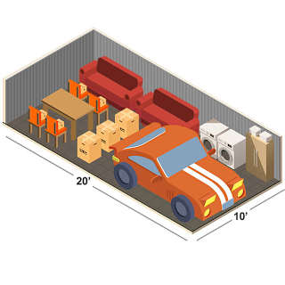 A red car is parked in a garage with a washing machine and a table with chairs.