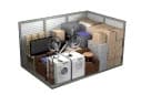 A 3D rendering of a room with a desk, computer, and other items.