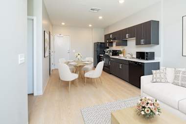 Furnished apartment living area shown at Garfield Terrace.