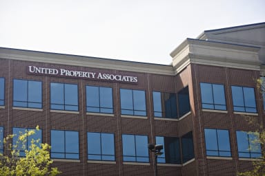 a photo of a building with the words united property associates on it