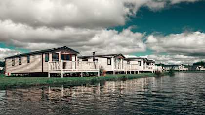 Floor Plan  A house is built on stilts over a body of water.