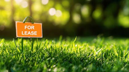 Floor Plan  A lease sign is placed on a green lawn.