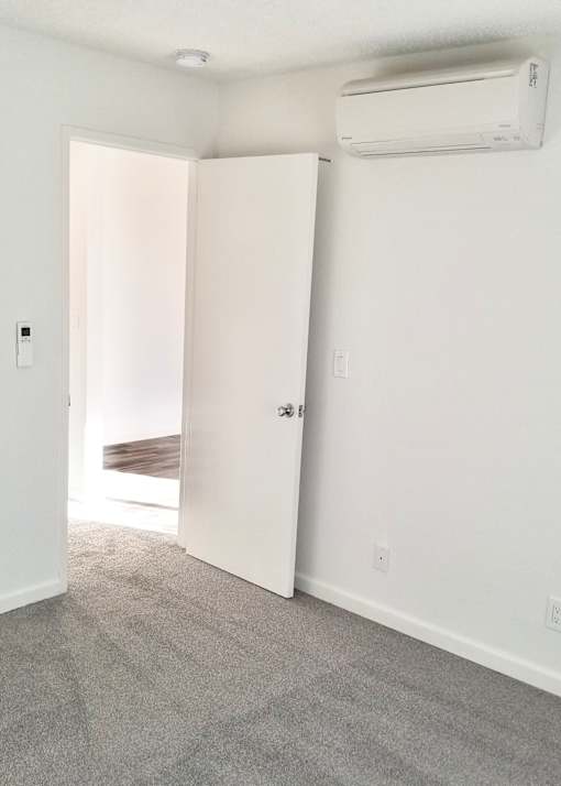 1x1jr bedroom with a carpet floor.