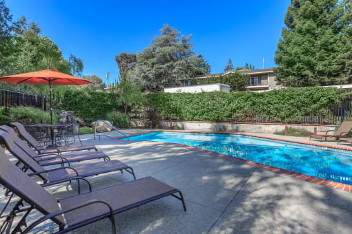 take a dip in the pool at the enclave at woodbridge apartments in sugar land, tx