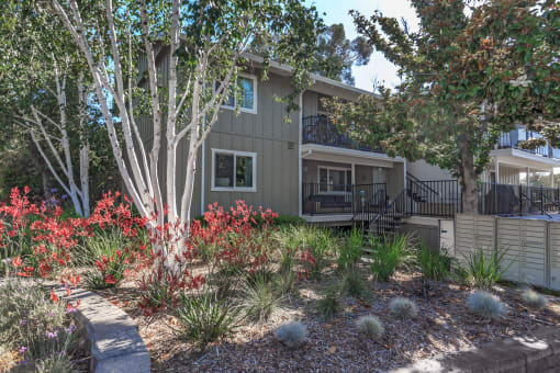 a view of the front of the house with a landscaped front yard