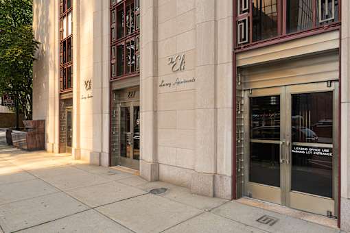 The entrance to a building with a glass door and a sign that reads "Learning Office Line.".