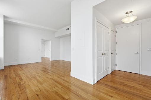 A room with wooden floors and white walls.