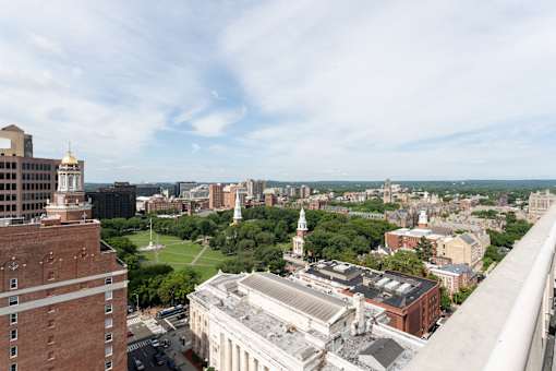 A cityscape with a large white building in the center.