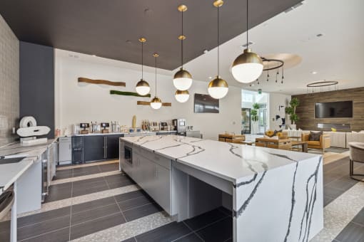 a kitchen with a large island and a dining room with chairs at LynnCora, Grand Prairie, 75052
