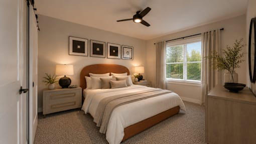 A bedroom with a large bed, a ceiling fan, and a window with blinds.