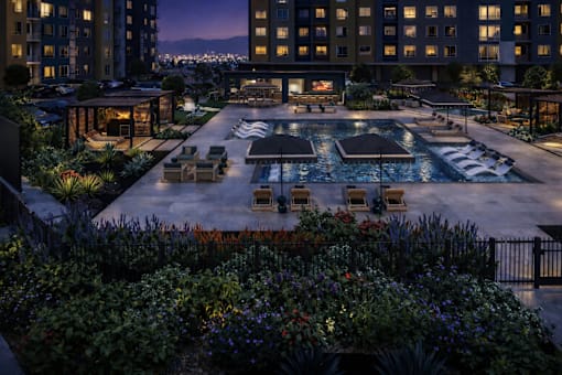 Beautifully lit outdoor pool area at Avela Luxury Apartments, Nevada, 89011