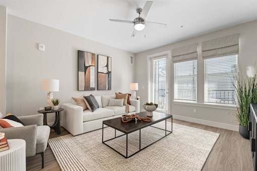 spacious living room with a couch and a coffee table and ceiling fan at Mira at Palmer Ranch, Sarasota