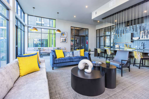 resident lounge great room with kitchen bar top seating at Zeta Luxury Apartments in Sacramento, CA