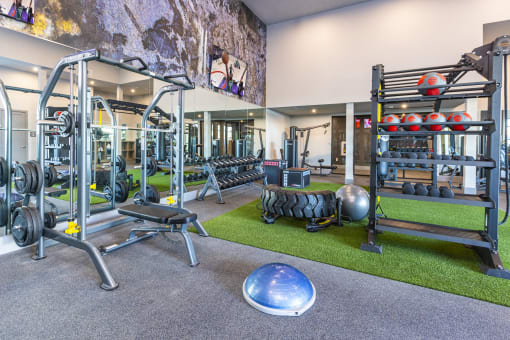 24 hour athletic center with weights and other exercise equipment at Zeta Luxury Apartments in Sacramento, CA
