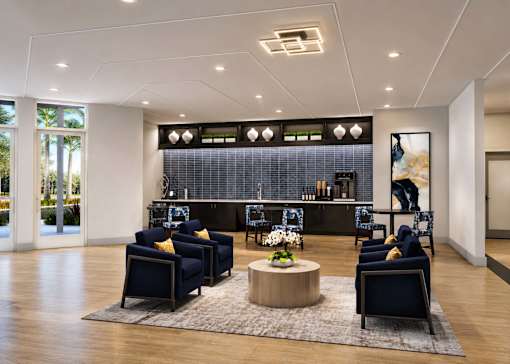A modern living room with a dark blue sofa set and a wooden coffee table.