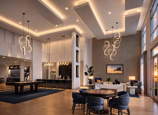 A modern living room with a pool table and a dining table.