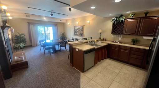 A kitchen with brown cabinets and a white countertop.