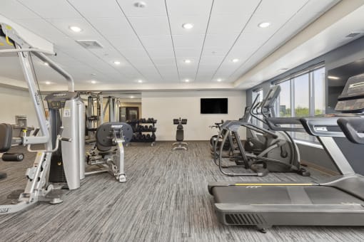 the gym at the enclave at woodbridge apartments in sugar land, tx