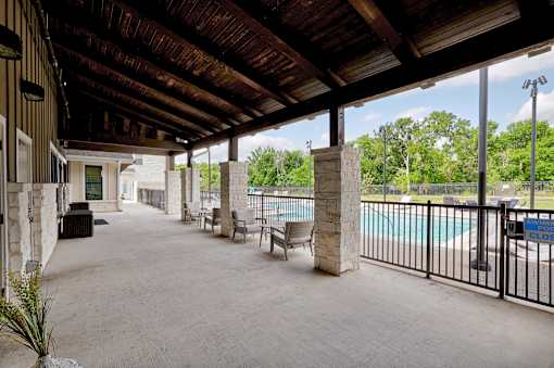 A covered patio area with a pool and a sign that says "Closed".