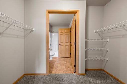 a spacious walk in closet in a 555 waverly unit
