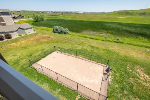 a view of the volleyball court from the top of the house