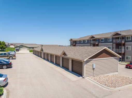 a row of garages at the enclave at woodbridge apartments in sugar land, tx