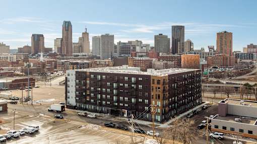 Aerial exterior of The Balsam on Broadway and St. Paul skyline