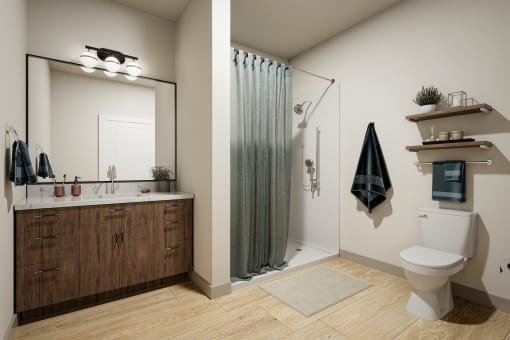 a bathroom with a toilet sink and shower in a 555 waverly unit