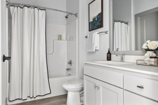savor apartments bathroom with tub and shower combo