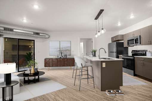 A modern kitchen with a dining table and chairs.