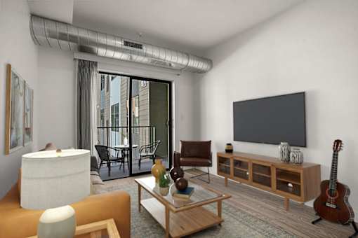 A living room with a guitar on the floor.