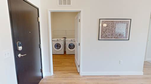 A laundry room with a washer and dryer in it.