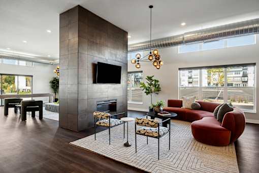 A modern living room with a fireplace and a television.
