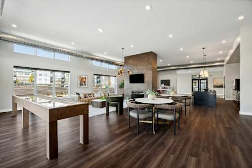 A modern living room with a wooden floor and furniture.