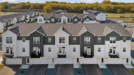 A large housing development with rows of houses.
