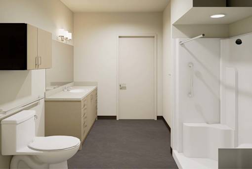 A white toilet is in a small bathroom with a sink and a shower.