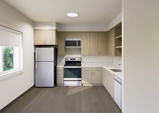 A kitchen with a refrigerator, oven, and microwave.